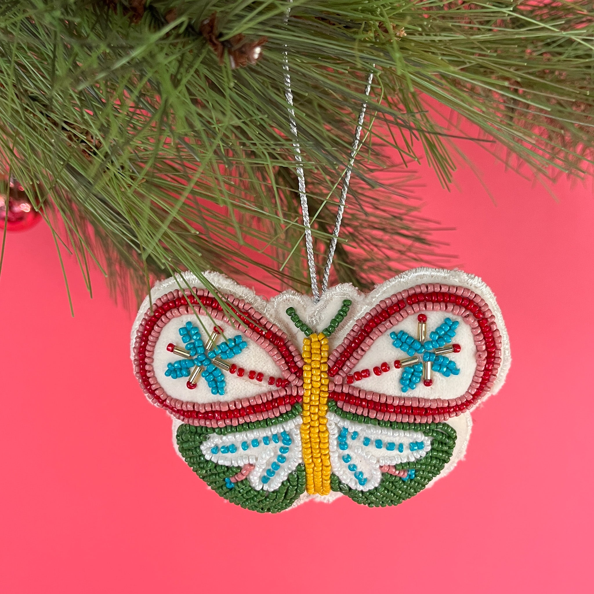 A beaded butterfly felt Christmas ornament