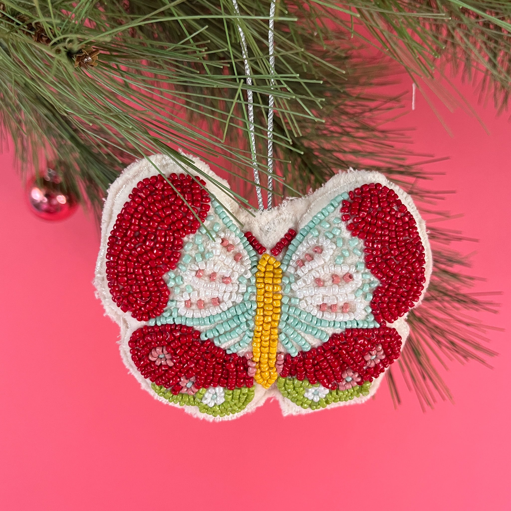 A beaded butterfly felt Christmas ornament