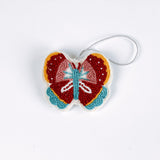 A beaded butterfly felt Christmas ornament