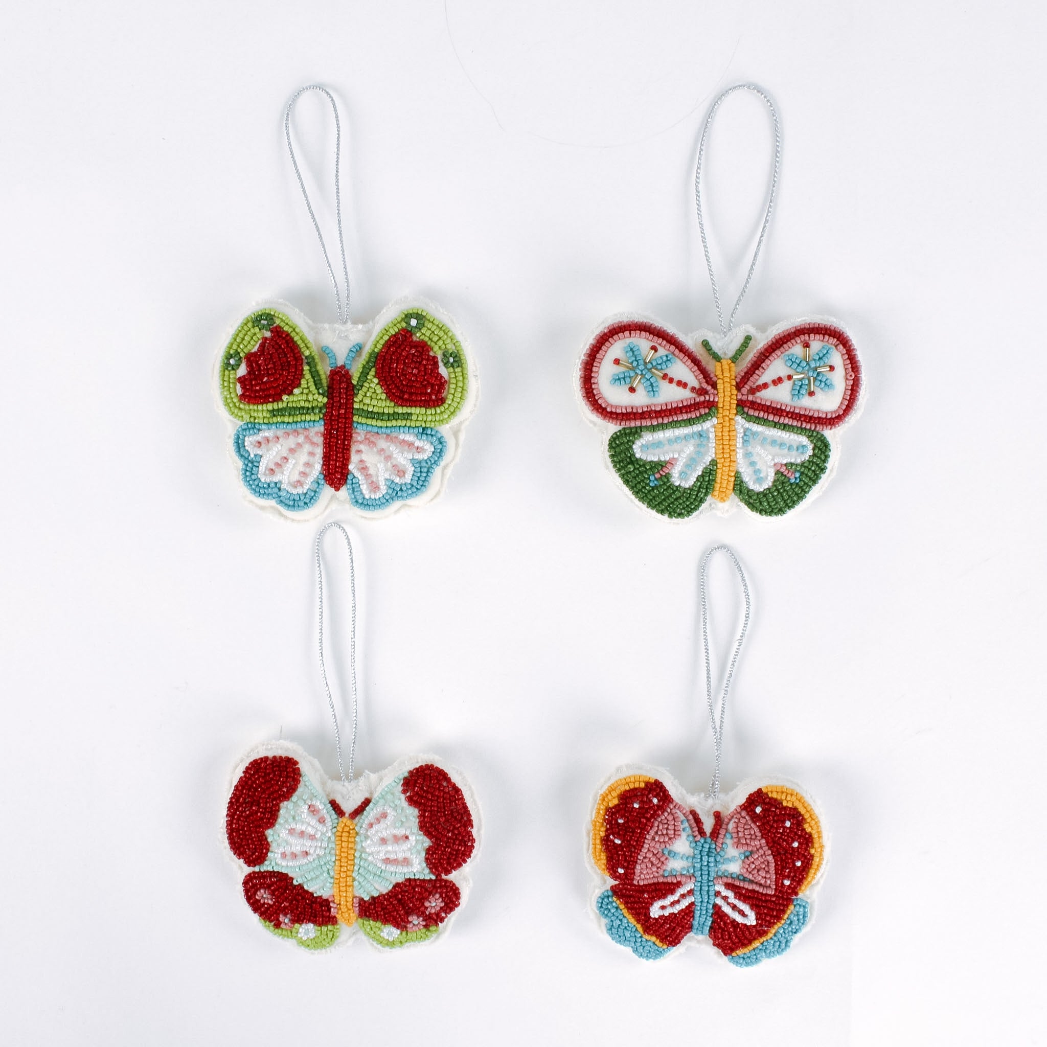 A set of four beaded butterfly felt Christmas ornaments
