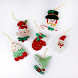 Handcrafted Holiday Icons Felt Christmas Ornaments featuring Santa, elf, snowman, mitten, Christmas tree, and reindeer designs in festive red, green, and white colors.