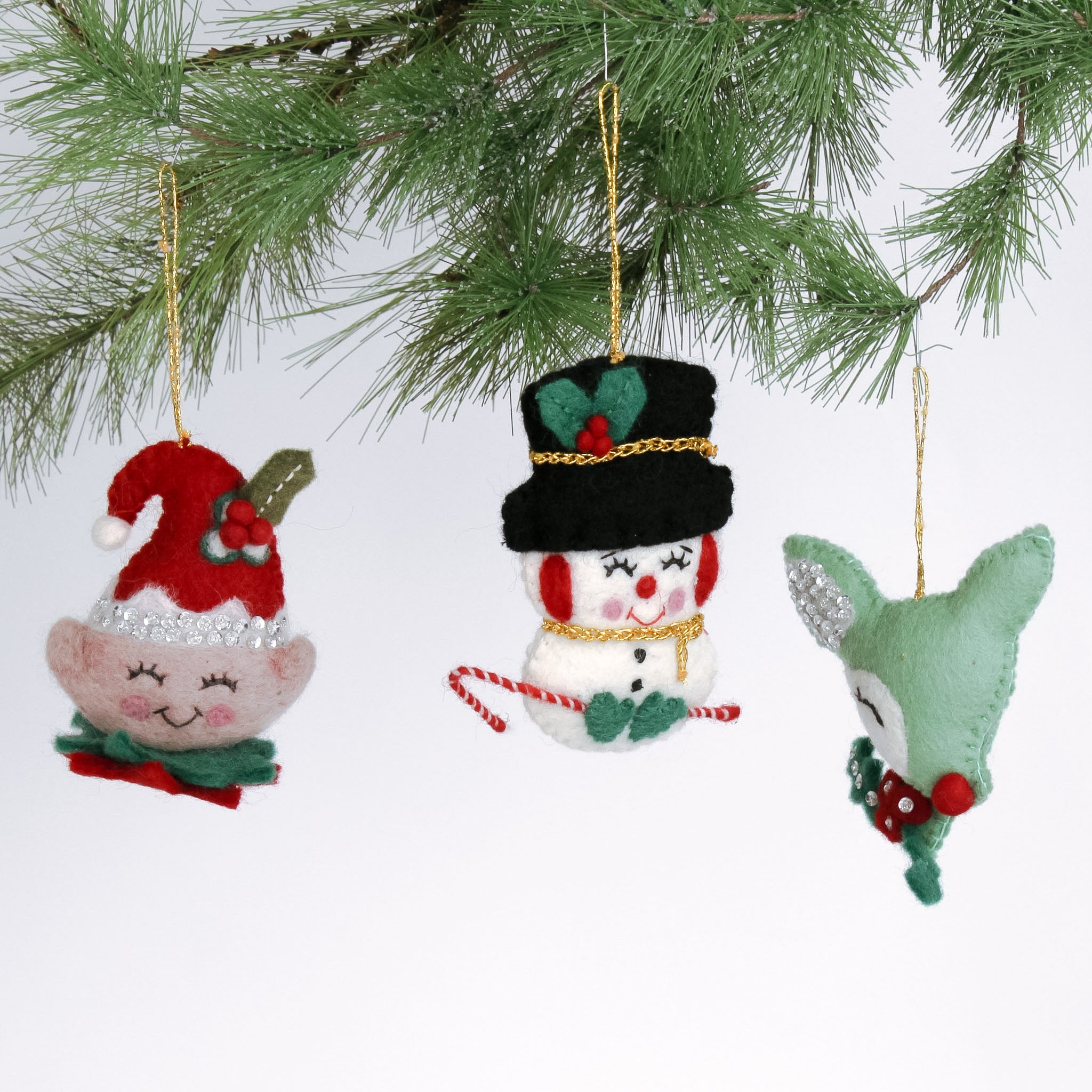 Handcrafted Holiday Icons Felt Christmas Ornaments featuring elf, snowman, and reindeer designs in festive red, green, and white colors.