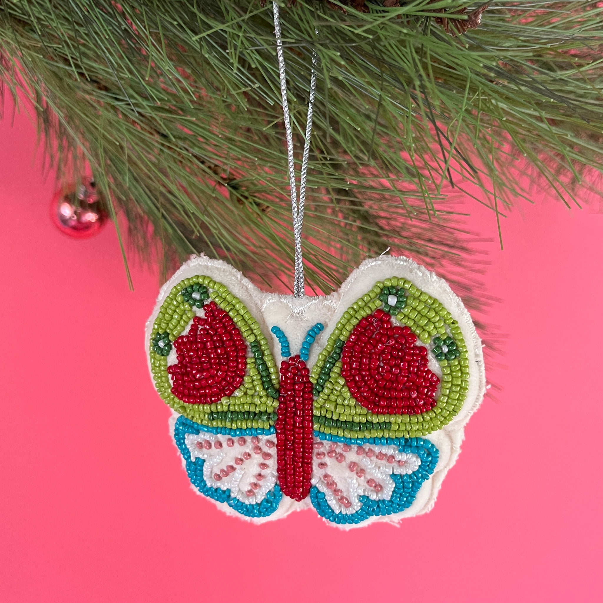 A beaded butterfly felt Christmas ornament
