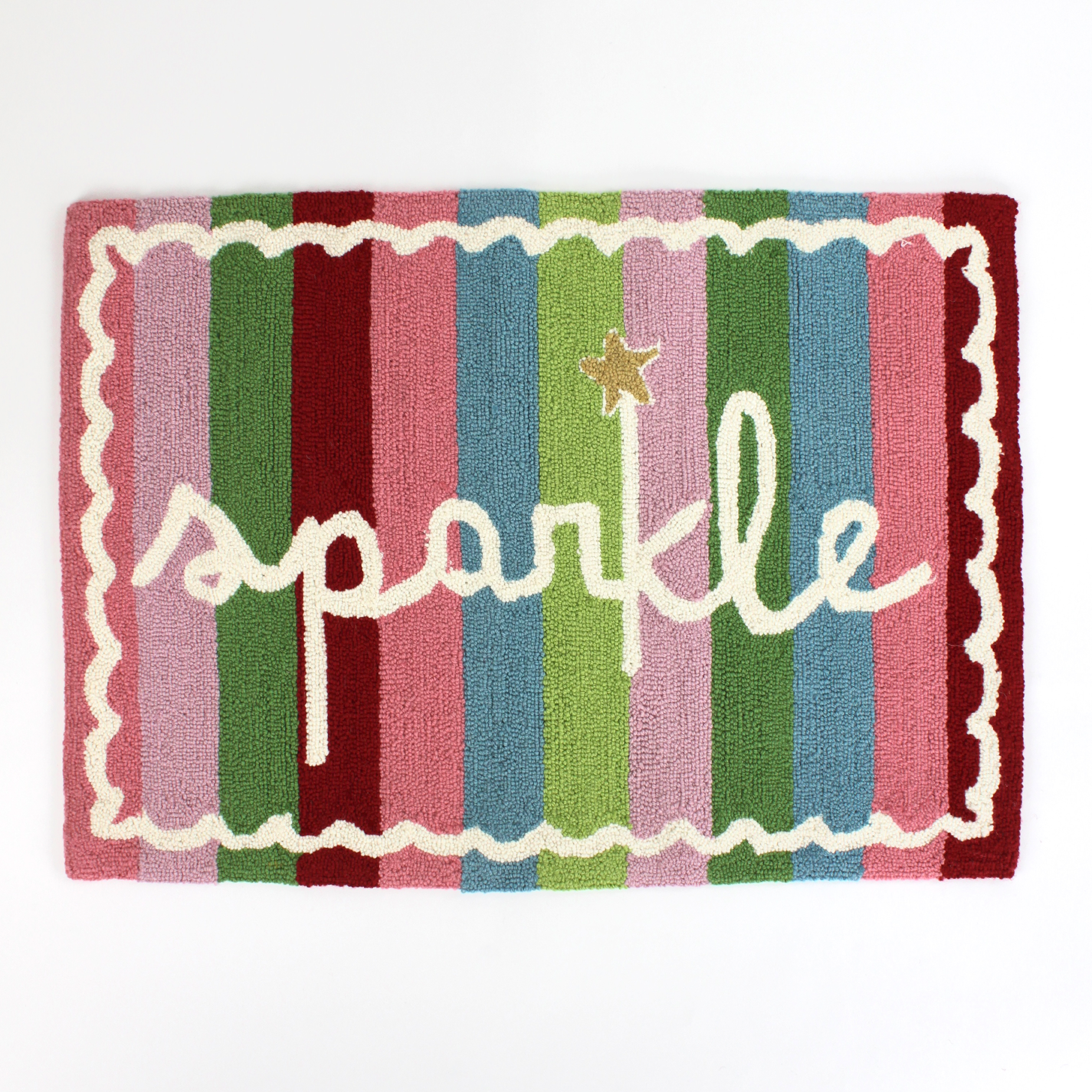 A striped rectantgular Christmas rug that says "sparkle" and has a white scalloped motif at the border
