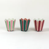 three striped cachepots in shades of pink, red and green from madcap cottage