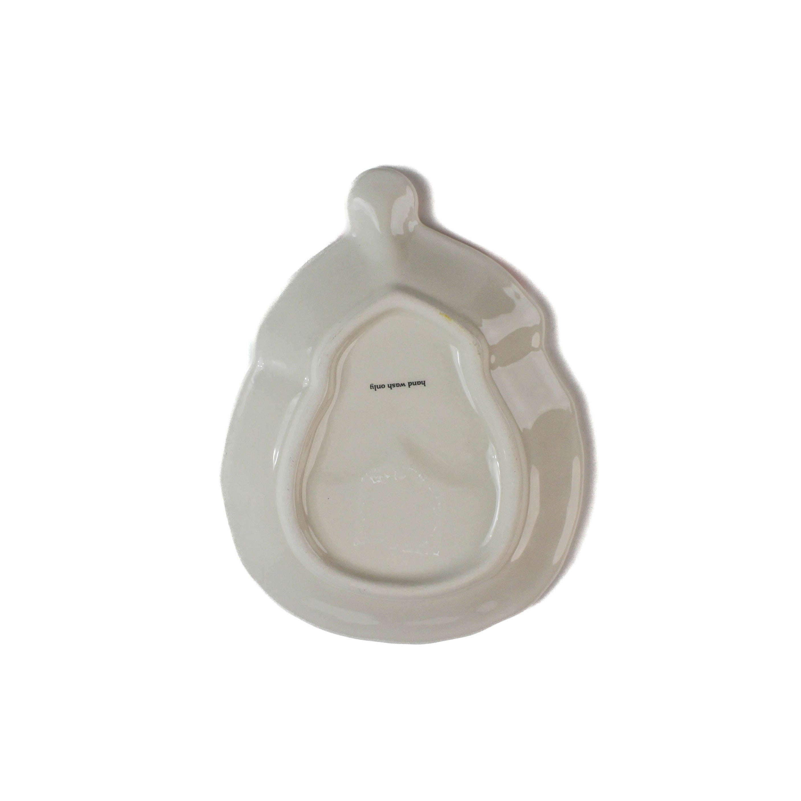 White ceramic christmas dish shaped like a santa face on a white background