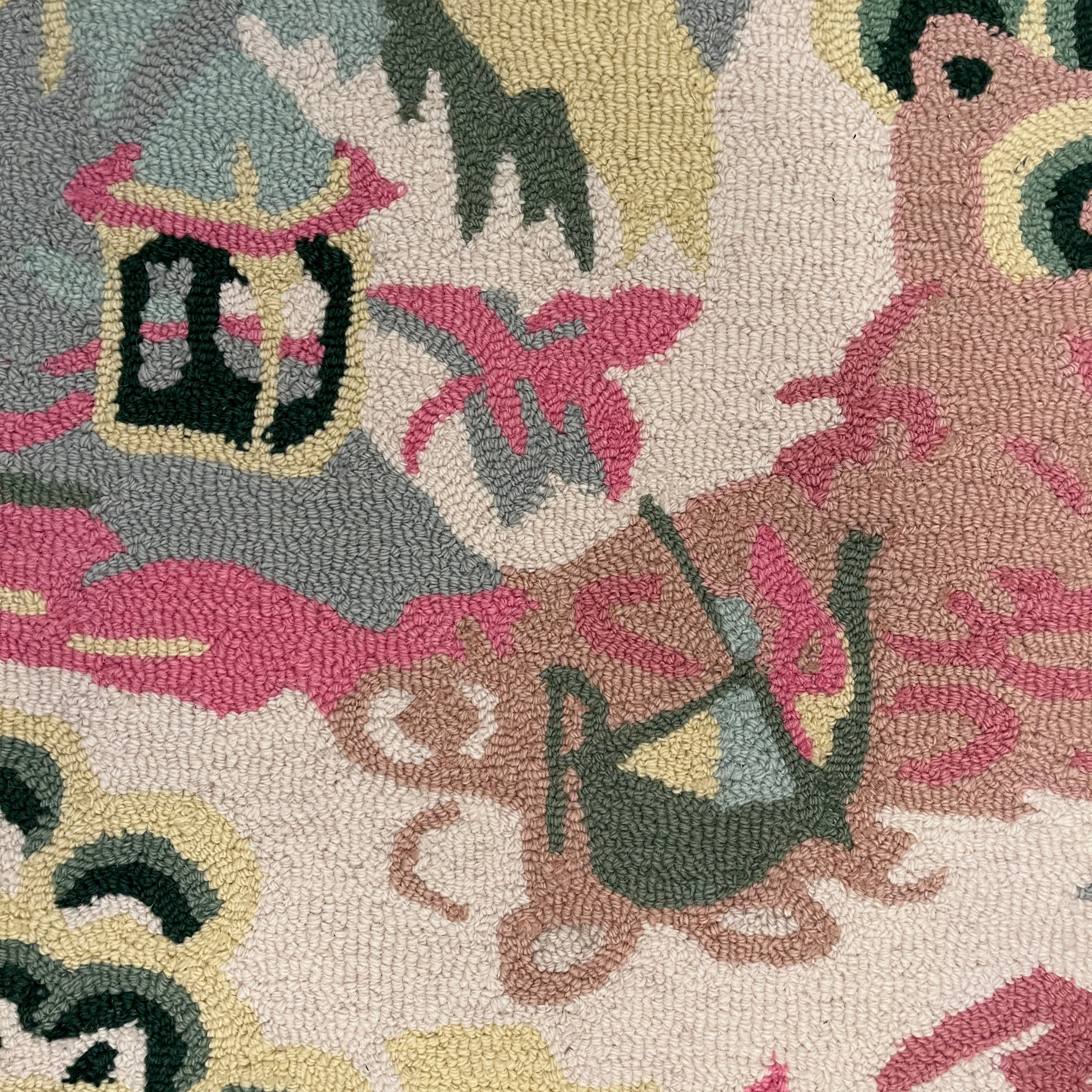 a close up of the boatman on an Old Peking pink and green rug with chinoiserie motifs from madcap cottage