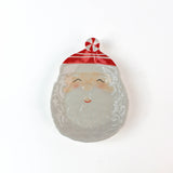 Decorative christmas plate with a Santa Claus design on a white background