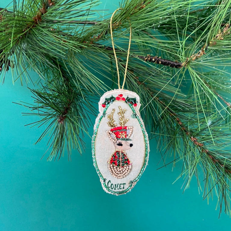 Detailed Hand Painted Beaded Comet Reindeer Christmas Ornament featuring reindeer with red and green accents.