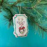 Hand Painted Beaded Reindeer Christmas Ornament with red flower and sequin details.