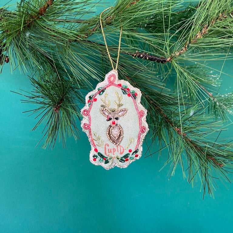 Hand Painted Beaded Reindeer Christmas Ornament with pink heart design.