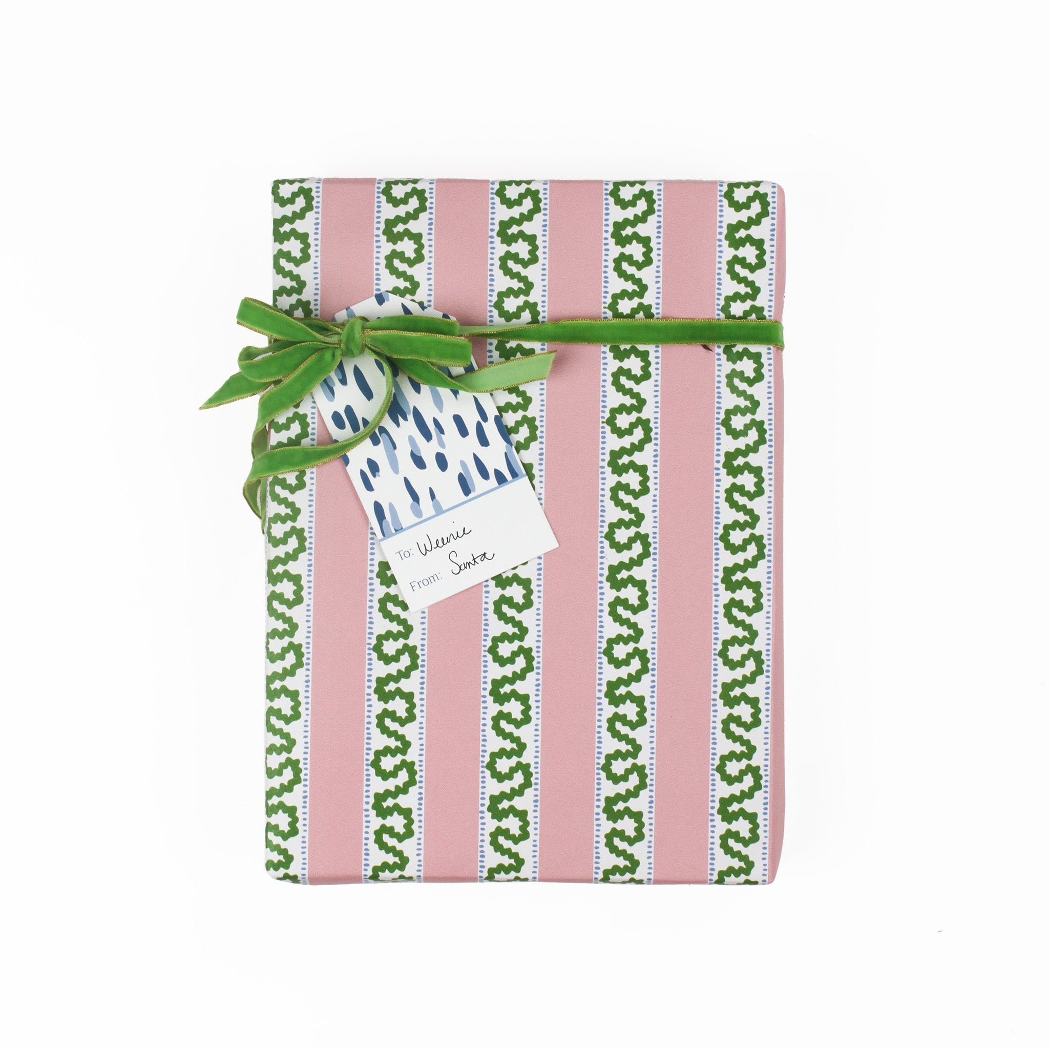 A blue gift tag with a geometric pattern, attached to a wrapped present