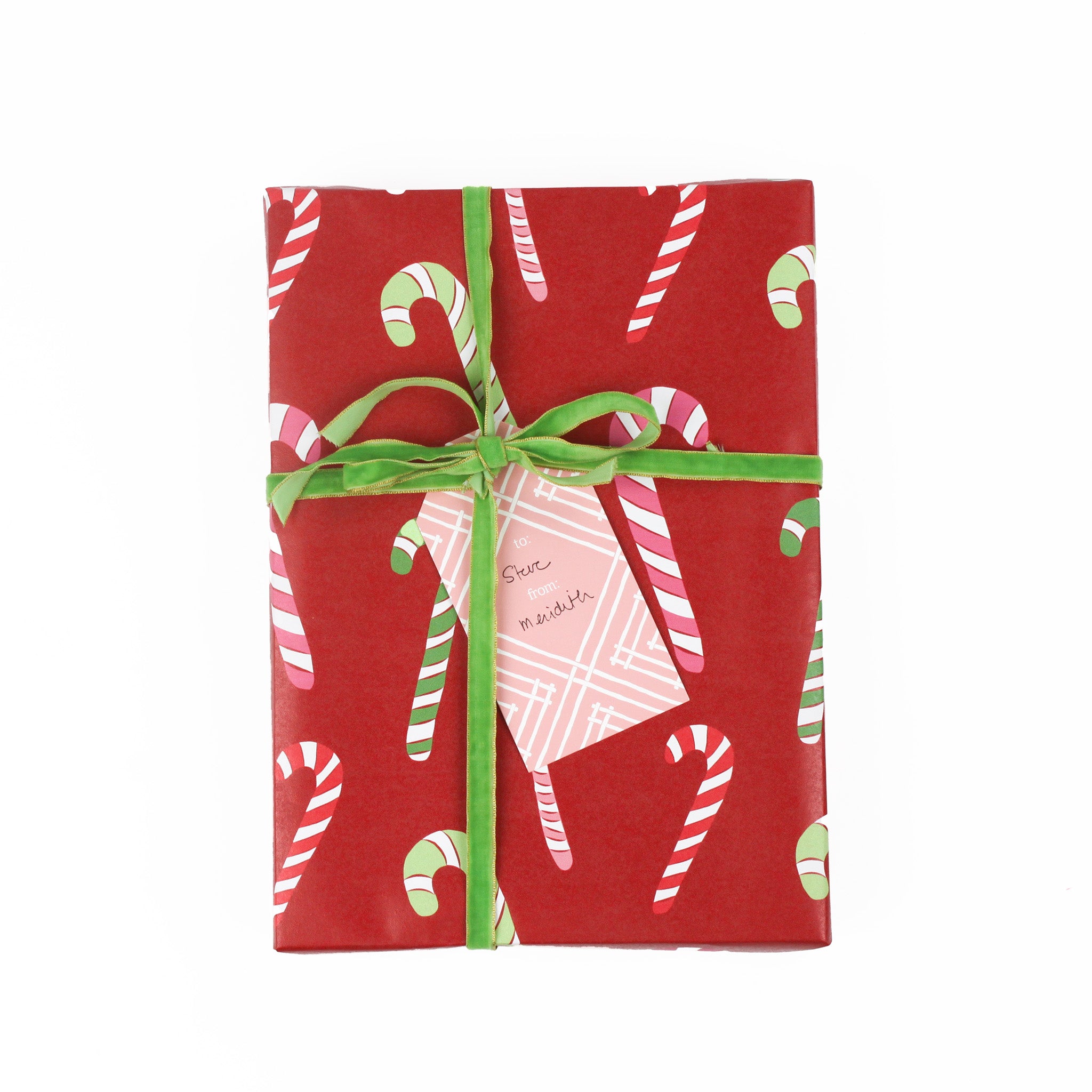 a gift tag with a geometric lattice pattern in pink, added to a wrapped present