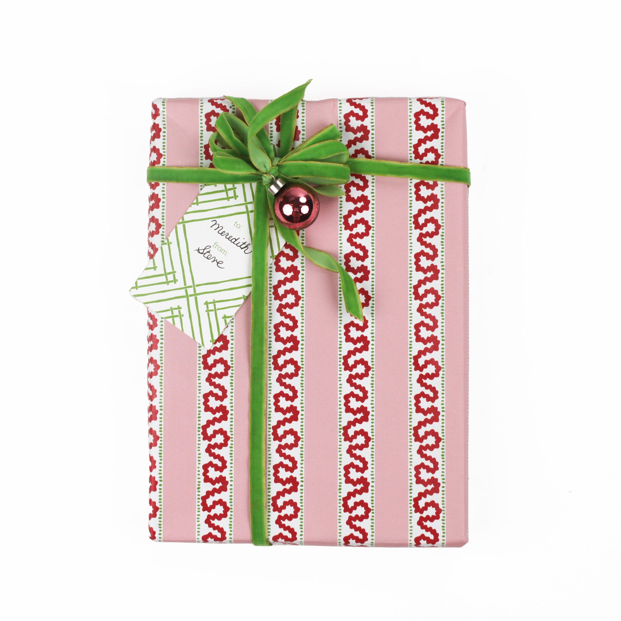 a gift tag with a geometric lattice pattern in green, added to a wrapped present