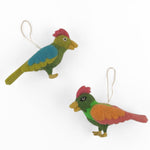 Felted wool Christmas bird ornaments featuring colorful feathers in green, blue, orange, and pink hues.