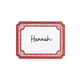 Elegant Geranium paper place card featuring a decorative red border and personalized names for table settings.