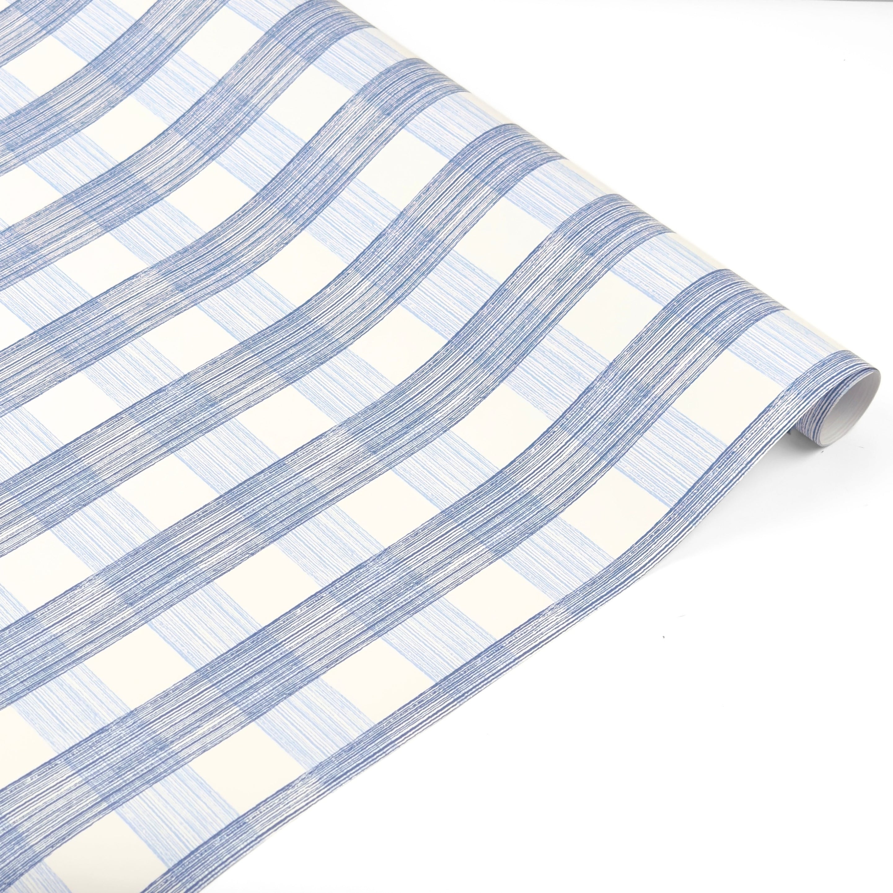 Blue gingham patterned Christmas wrapping paper roll on a white background.