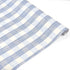 Blue gingham patterned Christmas wrapping paper roll on a white background.