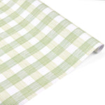 Roll of green and white gingham patterned holiday wrapping paper.
