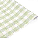 Roll of green and white gingham patterned holiday wrapping paper.