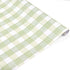 Roll of green and white gingham patterned holiday wrapping paper.