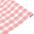Roll of pink and white gingham patterned holiday wrapping paper.