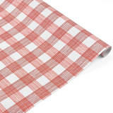 Roll of red and white gingham patterned holiday wrapping paper.