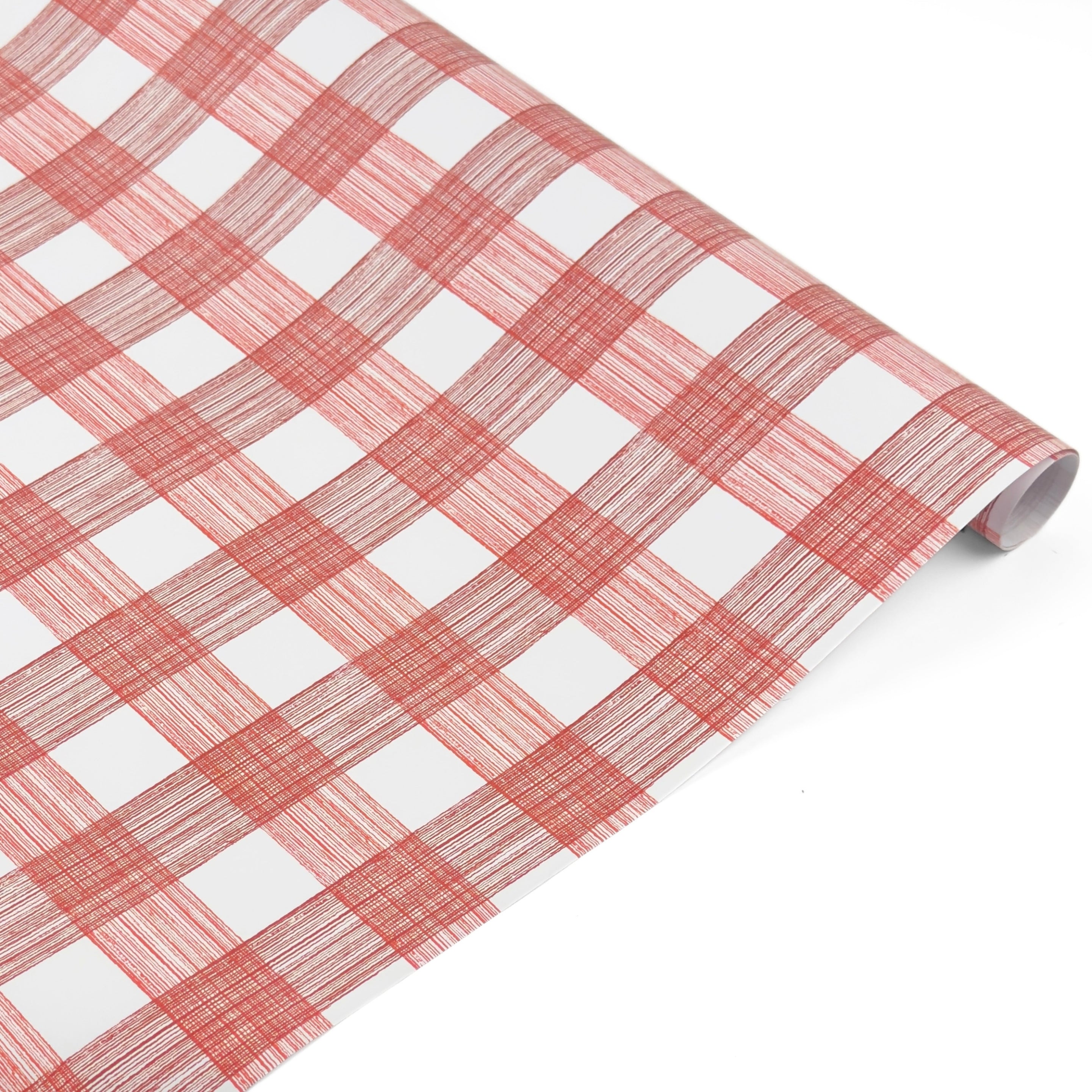 Roll of red and white gingham patterned holiday wrapping paper.