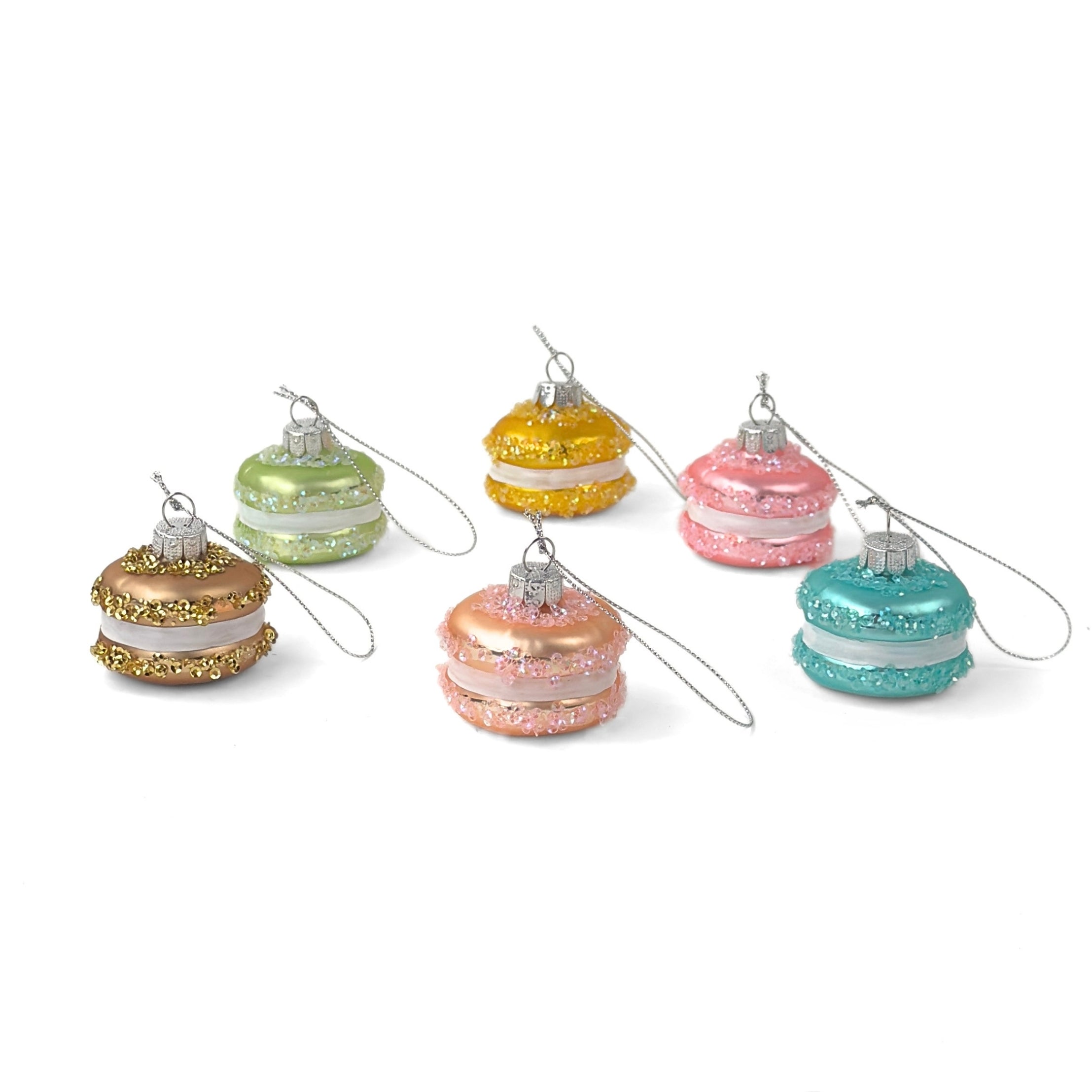 Colorful glass macaron Christmas ornaments featuring pastel shades, sparkling glitter accents, and elegant hanging loops.