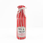 red and white striped wine bag with a “Santa, I have been goodish” label on the front