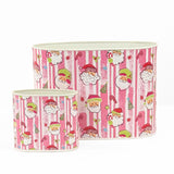 Festive Christmas caddy set featuring cheerful Santa faces, pink stripes, candy canes, and holiday decorations.