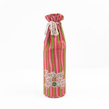 pink and green striped wine bag with “Let’s get jolly!” printed on the front