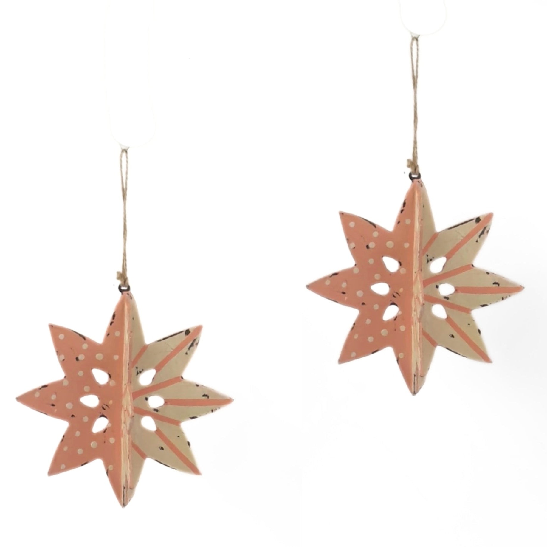 set of two large wooden star christmas ornaments painted in pink and white with distressed polka dot details