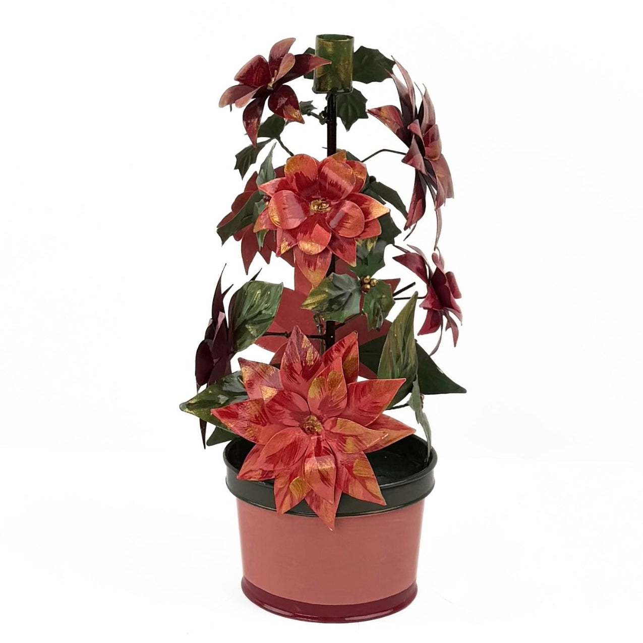 A large metal handpainted Christmas candle holder featuring red poinsettia flowers and green holly leaves with a pink base. 