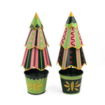 A set of two tole metal Christmas Tree Centerpieces patterned with stripes, scallops and spots in green and yellow painted bases in Madcap Cottag motifs. 