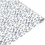 Roll of blue brushstroke wrapping paper on a white background.