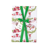 A wrapped gift box featuring holiday wrapping paper with a festive Christmas mouse pattern, tied with a bright green ribbon and bow. The paper is decorated with illustrations of white mice wearing red scarves and holding red gift boxes, surrounded by green holly and wreath motifs.