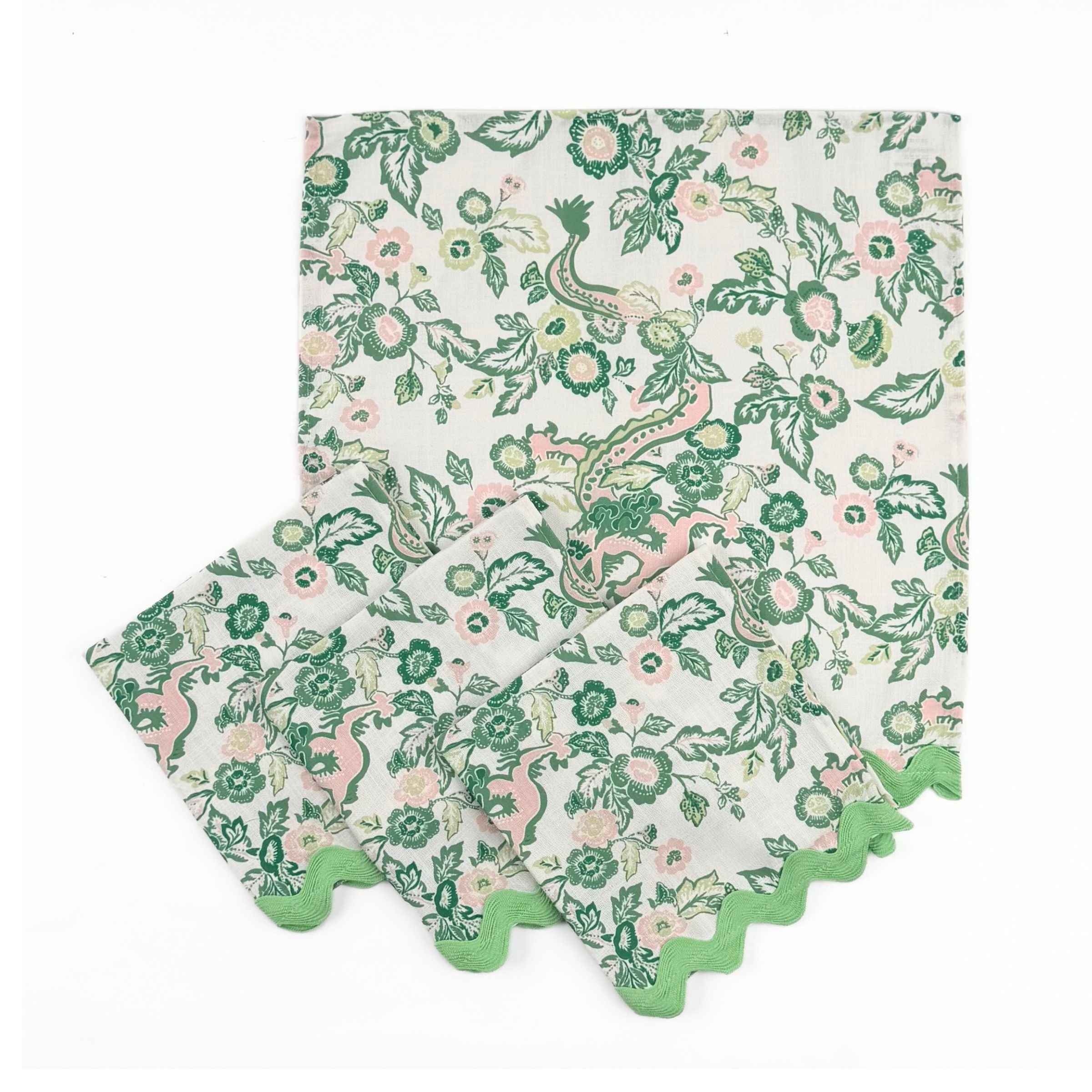 Set of Cloth dinner napkins featuring green Chinese dragon and pink floral prints with green ric rac trim.