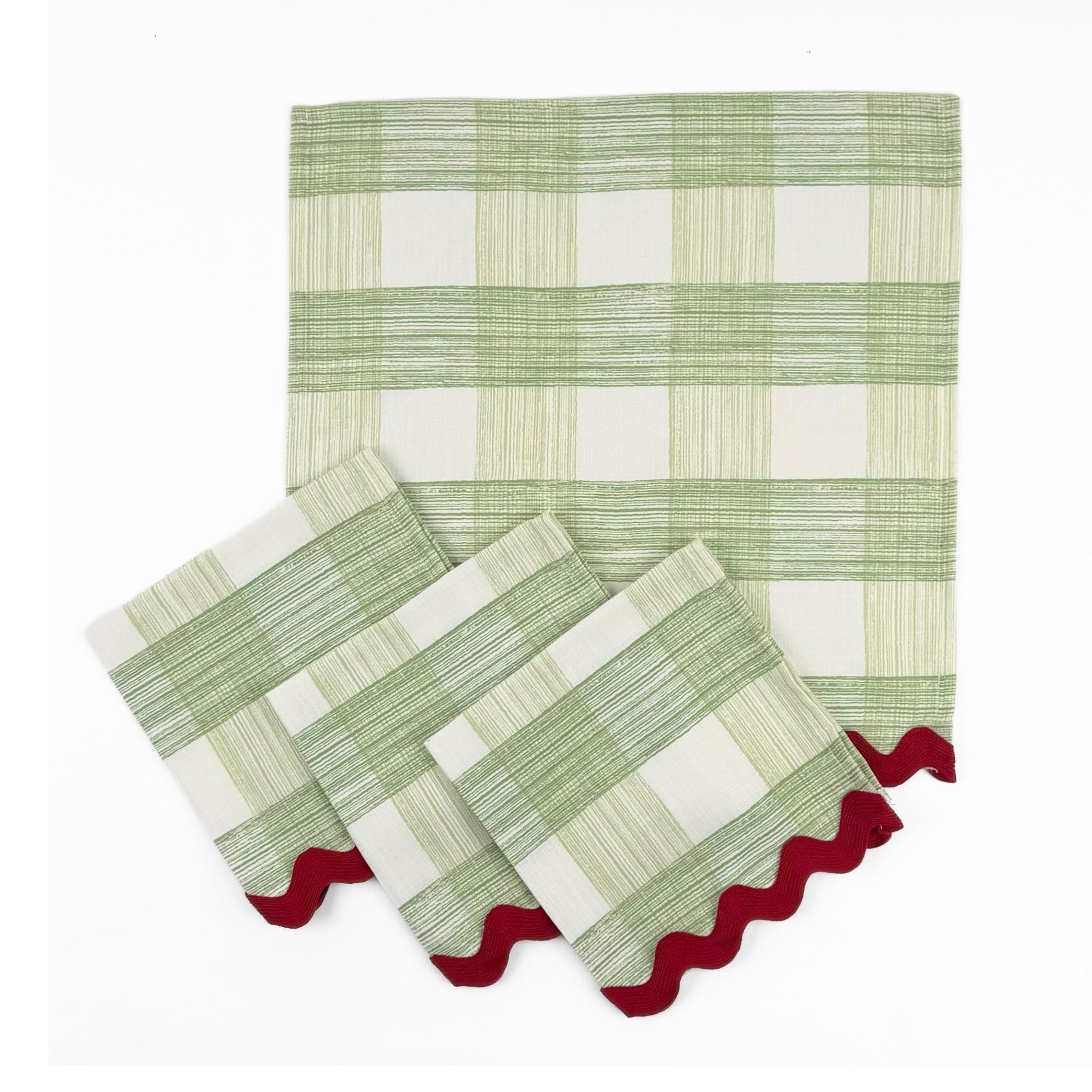 Set of Green and white gingham cloth dinner napkins featuring red scalloped trim for charming holiday tablescapes.