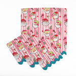 Set of Pink striped Christmas dinner napkins featuring cheerful Santa faces, festive motifs, and turquoise ric rac trim.