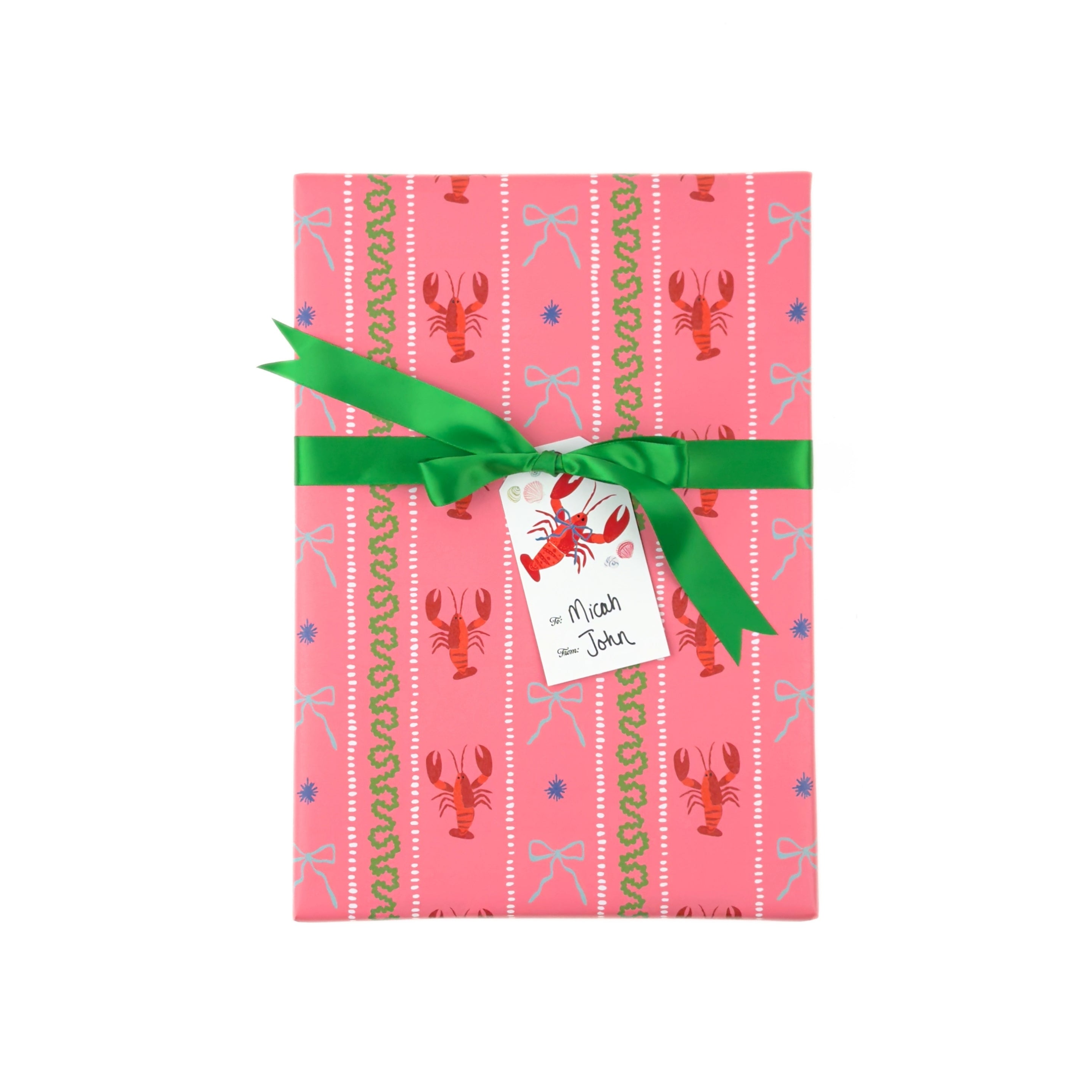 a present wrapped pink gift wrap with lobster, blue bow and green squiddly line motifs and a green bow
