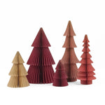 Five 3D papercraft Christmas trees in various sizes and colors, including shades of beige, rust, terracotta, and burgundy, arranged on a white background.