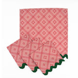 Set of Pink cloth dinner napkins featuring red bamboo trellis patterns and dark green scalloped trim accents.