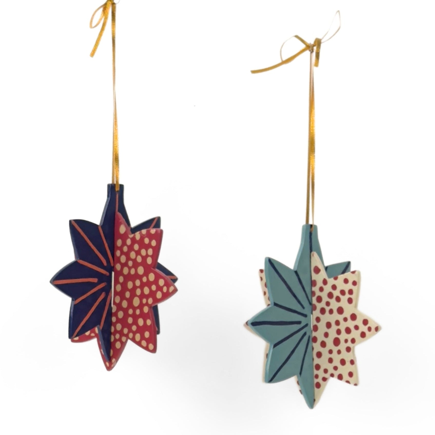 Hand-painted wooden patriotic star ornaments featuring red, white, and blue designs with decorative gold hanging cords.