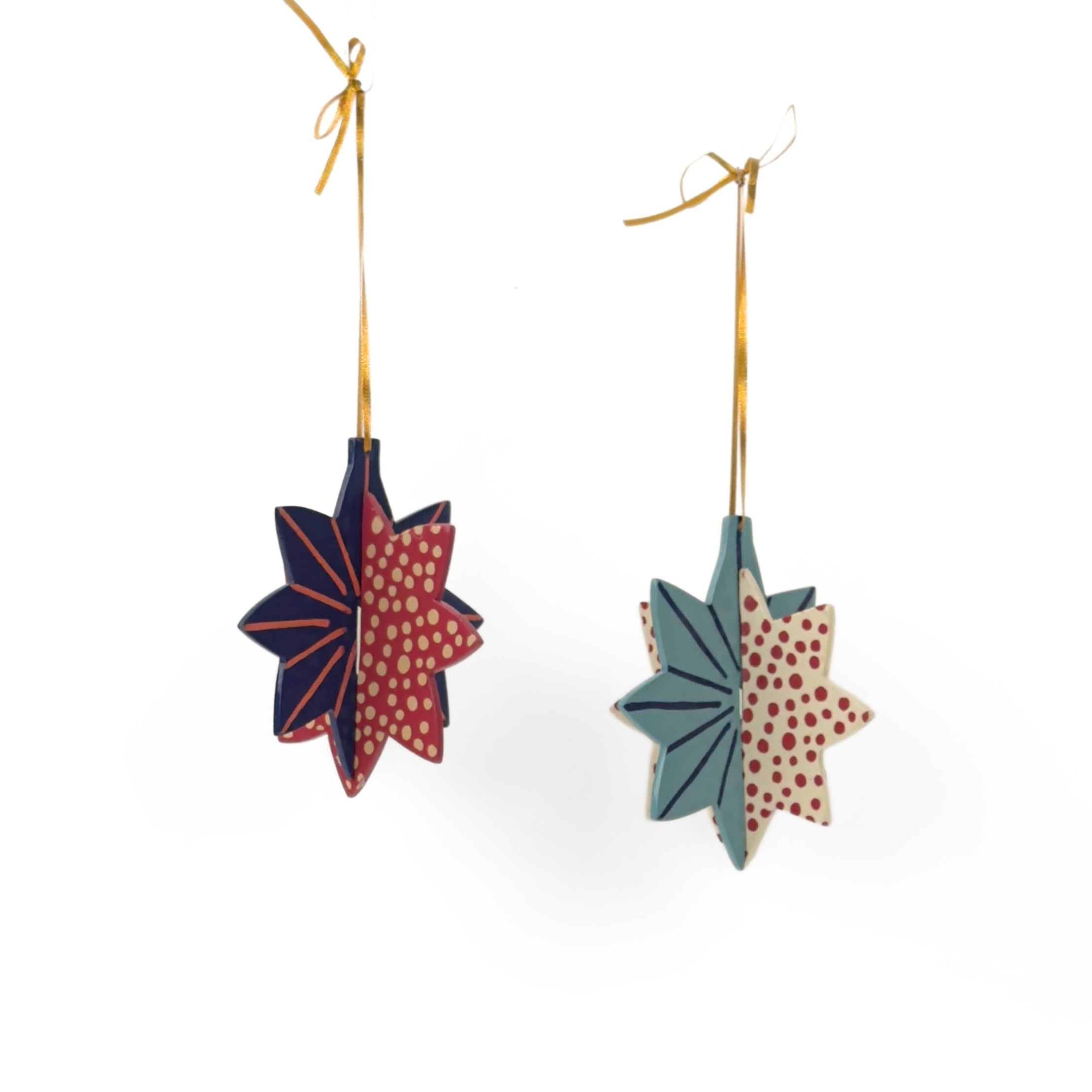 Hand-painted wooden patriotic star ornaments featuring red, white, and blue designs with decorative gold hanging cords.