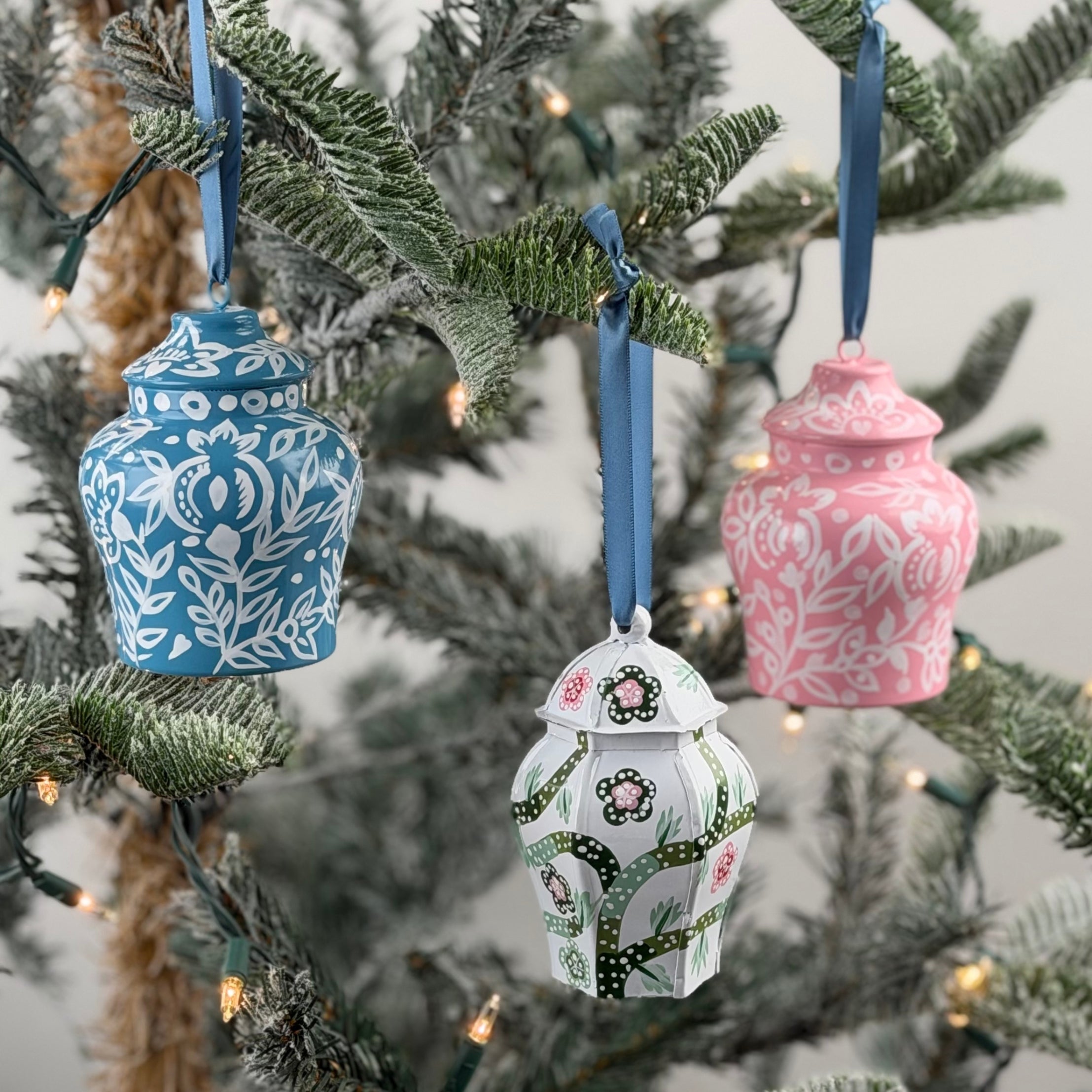 Set of Elegant ginger jar ornaments featuring intricate floral patterns in blue, pink, and green with ribbons.