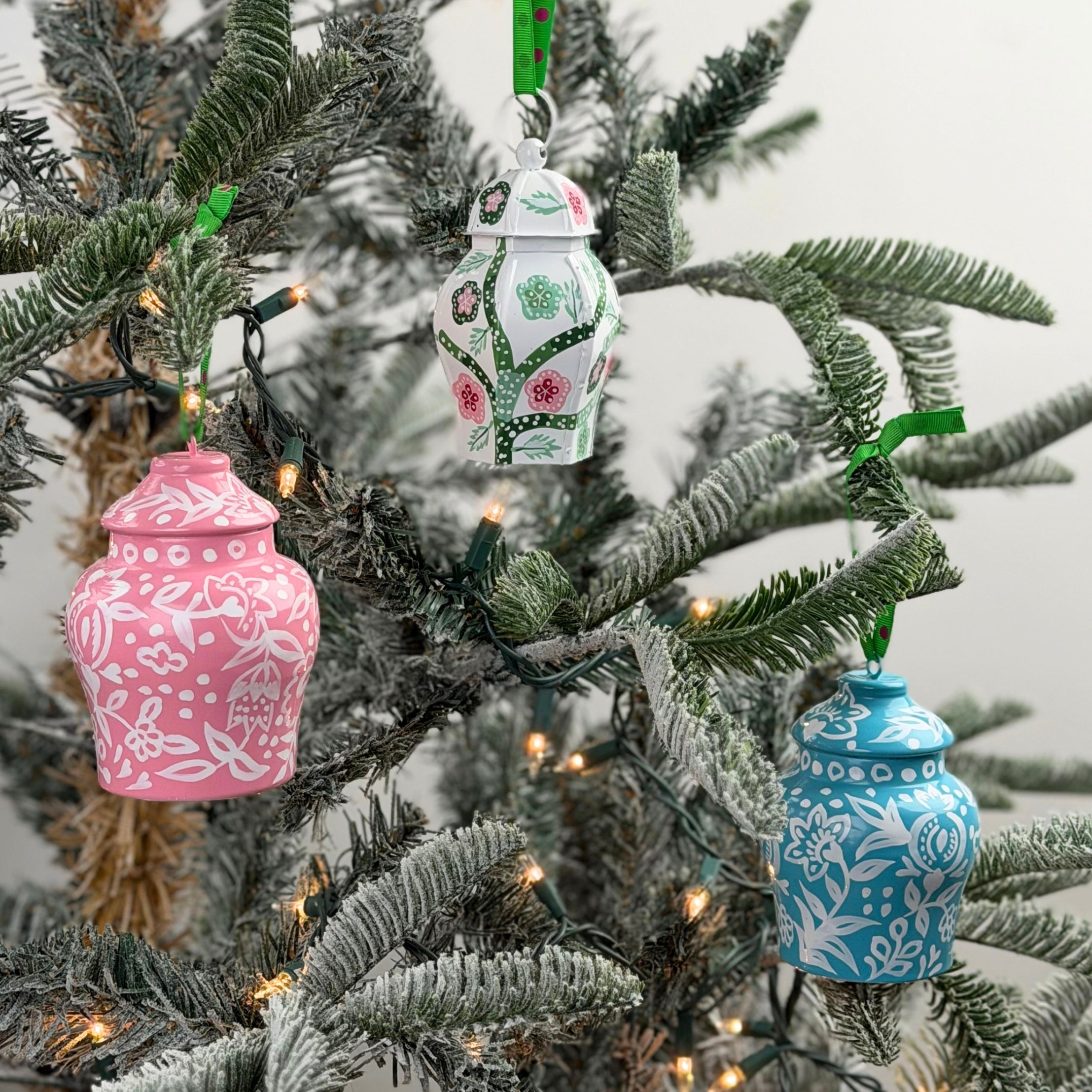 Chinoiserie ginger jar Christmas ornaments featuring intricate floral patterns in blue, pink, and green designs.