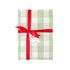 Green gingham gift wrap styled with red ribbon and holiday gift tag.