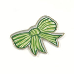 Green and white striped bow-shaped decorative tray with gold outline displayed on a white background.