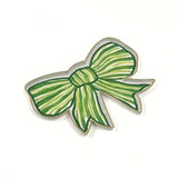 Green and white striped bow-shaped decorative tray with gold outline displayed on a white background.